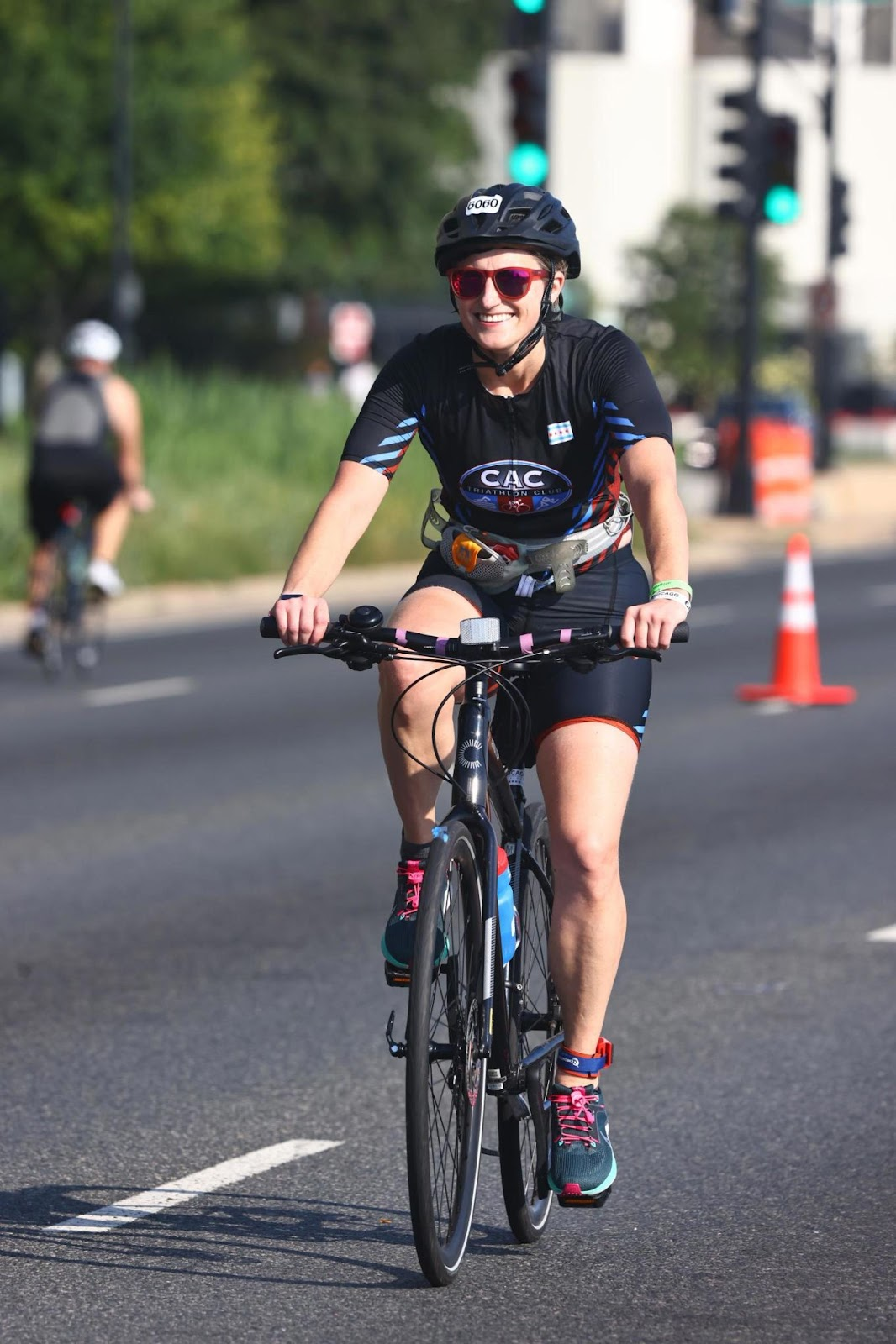 Dr. Jessica Rhodes riding a bike